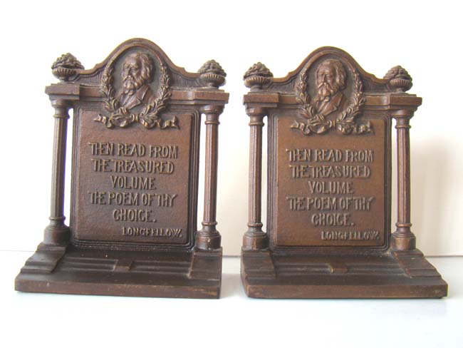 A pair of Antique Bookends by Bradley & Hubbard circa 1925 with a quote by Longfellow
